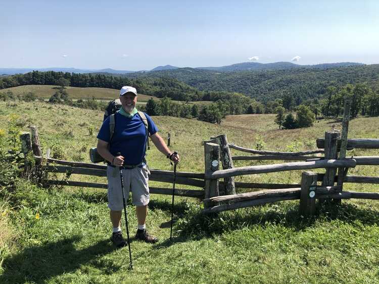 Crossing through stile into meadow.